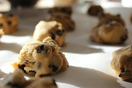 Cookie dough balls on a baking sheet