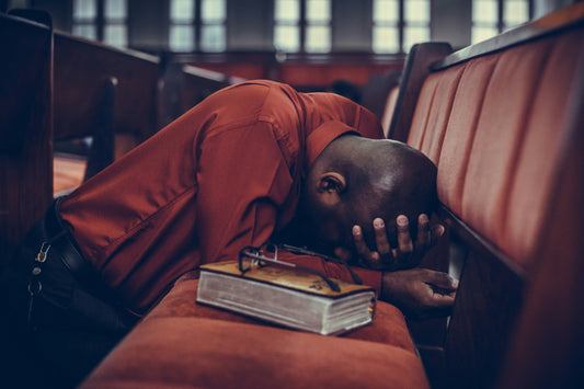 Man bowing in prayer